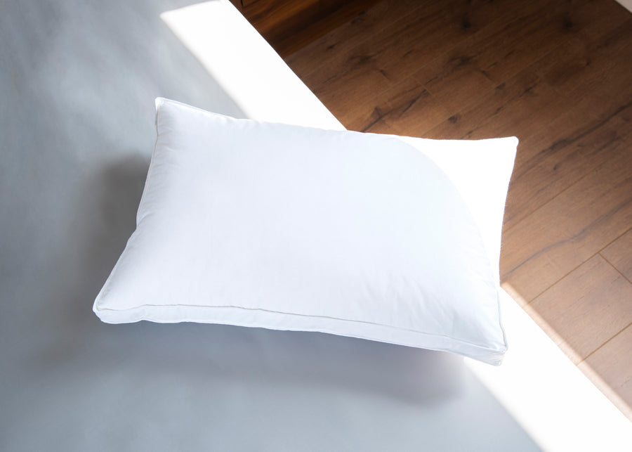 Origin Feather Down Pillow aerial product lifestyle shot