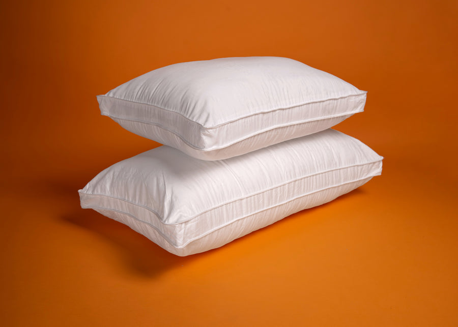 white recycled plastics polyester pillows stacked