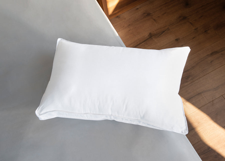 white cotton striped pillow on bed lifestyle